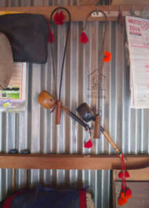 Two Pena that Oja Dingbulung has made by hand hang on the wall of his home. Oja is perhaps the last of the Kabui pena players.